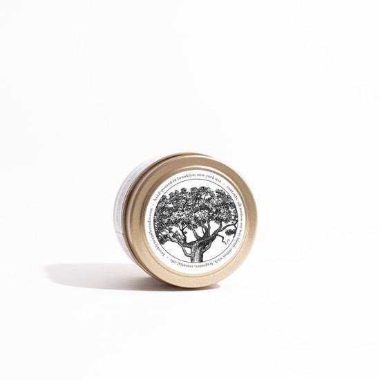 Load image into Gallery viewer, Brooklyn Candle Studio Palo Santo Gold Travel Candle - lily &amp;amp; onyx

