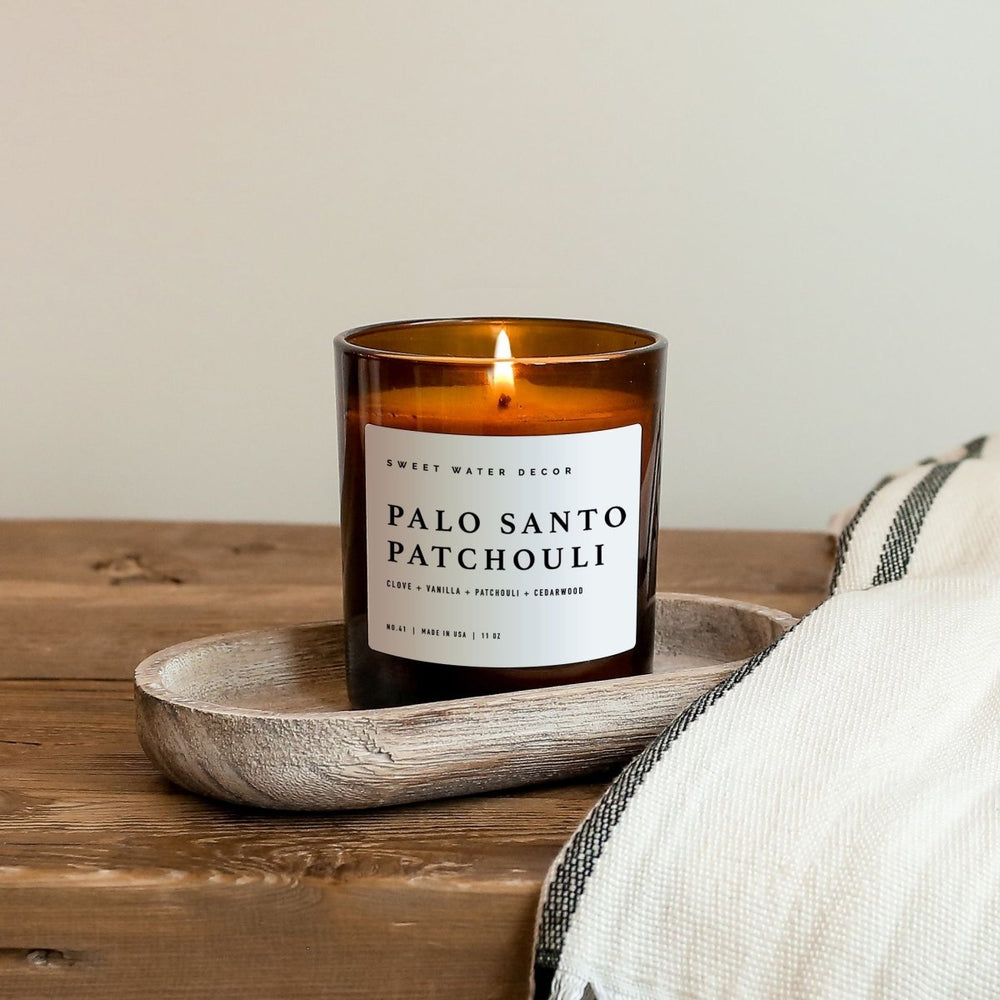 Sweet Water Decor Palo Santo Patchouli Soy Candle - Amber Jar - 11 oz - lily & onyx