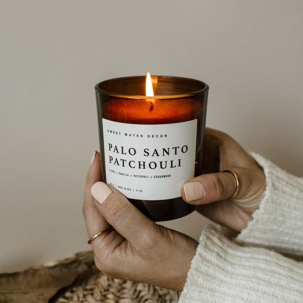 
                      
                        Sweet Water Decor Palo Santo Patchouli Soy Candle - Amber Jar - 11 oz - lily & onyx
                      
                    