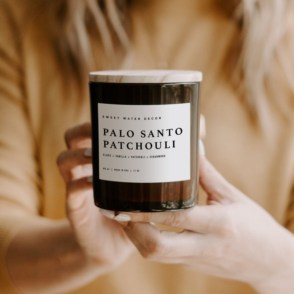 
                      
                        Sweet Water Decor Palo Santo Patchouli Soy Candle - Amber Jar - 11 oz - lily & onyx
                      
                    
