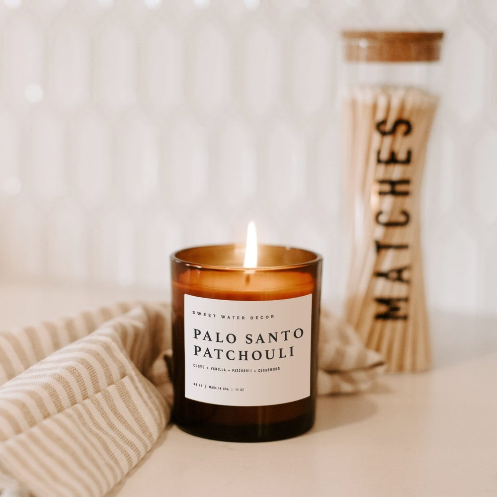 
                      
                        Sweet Water Decor Palo Santo Patchouli Soy Candle - Amber Jar - 11 oz - lily & onyx
                      
                    