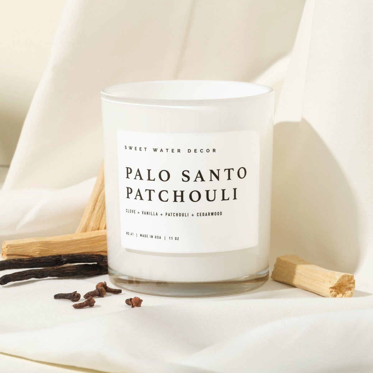 Sweet Water Decor Palo Santo Patchouli Soy Candle - White Jar - 11 oz - lily & onyx