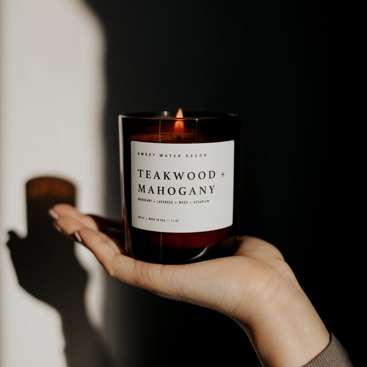 Sweet Water Decor Teakwood and Mahogany Soy Candle - Amber Jar - 11 oz - lily & onyx