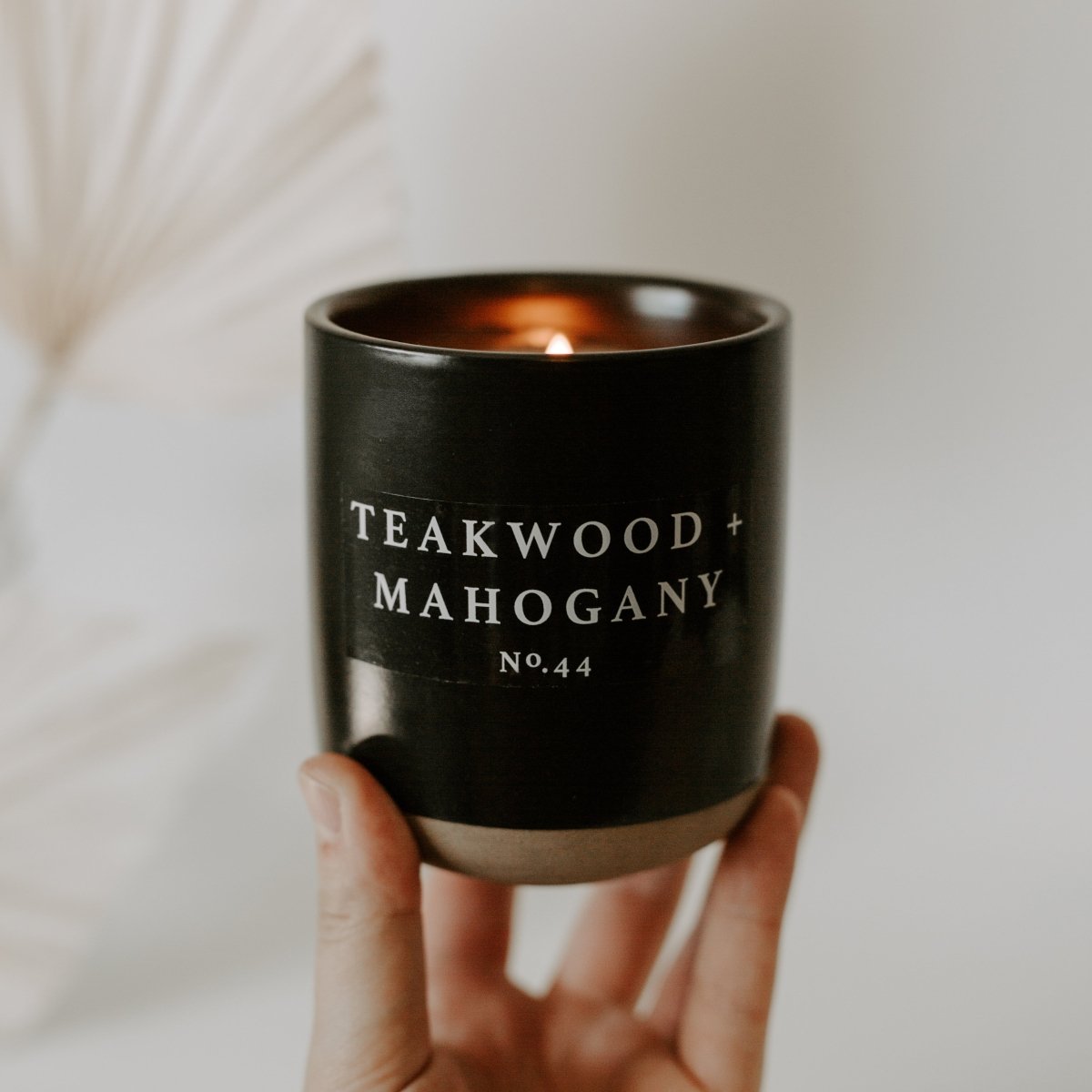 Sweet Water Decor Teakwood and Mahogany Soy Candle - Black Stoneware Jar - 12 oz - lily & onyx
