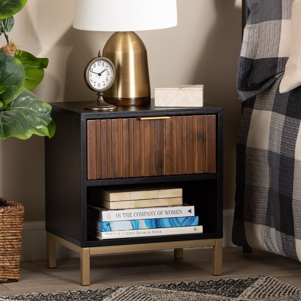 
                      
                        Baxton Studio Uriel Mid Century Modern Natural Brown & Black Finished Wood & Gold Metal Drawer Nightstand - lily & onyx
                      
                    