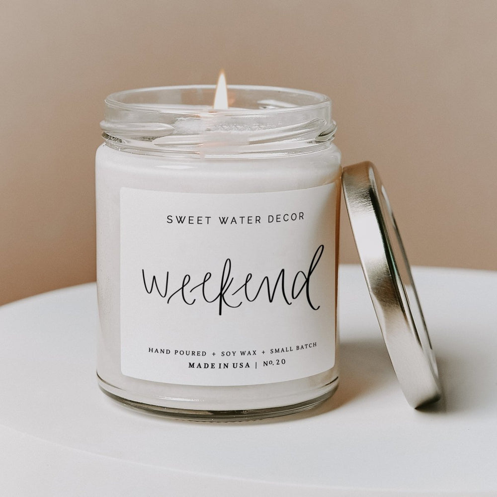 
                      
                        Sweet Water Decor Weekend Soy Candle - Clear Jar - 9 oz - lily & onyx
                      
                    